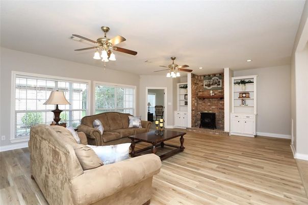 Fireplace, Interior, Living room, Recessed Lighting, Stone Walls, Wood Texture Flooring