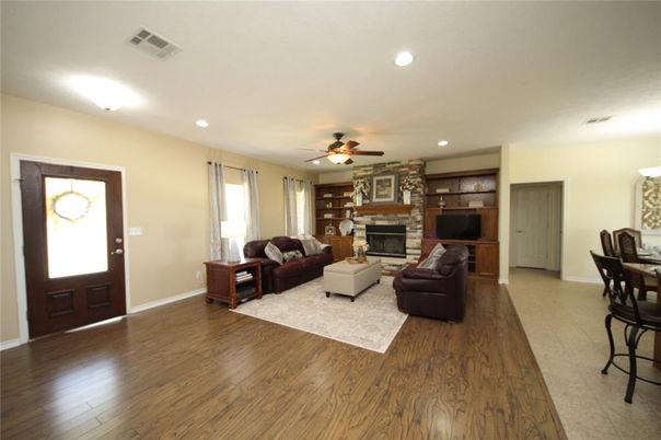Dining room, Fireplace, Interior, Living room, Recessed Lighting, Wood Texture Flooring