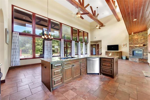 Fireplace, Interior, Kitchen, Pendant Lights, Recessed Lighting, Stainless Steel Appliances, Stone Walls, Wooden Beams, Wooden Ceilings