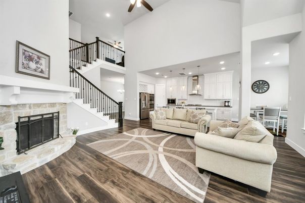 Fireplace, Interior, Kitchen, Living room, Pendant Lights, Recessed Lighting, Stainless Steel Appliances, Wood Texture Flooring
