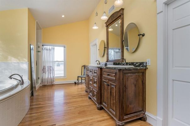 Bathroom, Dual Sink Vanities, Interior, Pendant Lights, Recessed Lighting, Wood Texture Flooring