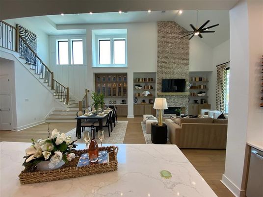 Dining room, Fireplace, Interior, Living room, Recessed Lighting, Stone Walls, Wood Texture Flooring