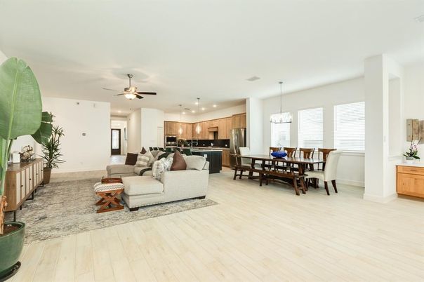 Chandelier, Dining room, Interior, Kitchen, Living room, Pendant Lights, Recessed Lighting, Stainless Steel Appliances, Wood Texture Flooring