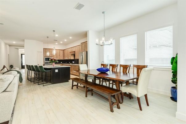 Chandelier, Dining room, Interior, Kitchen, Pendant Lights, Recessed Lighting, Stainless Steel Appliances, Wood Texture Flooring