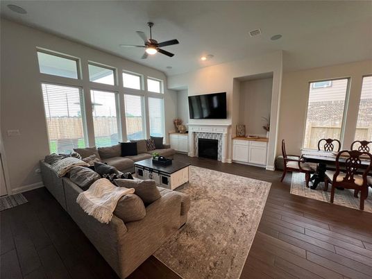 Dining room, Fireplace, Interior, Living room, Recessed Lighting, Wood Texture Flooring