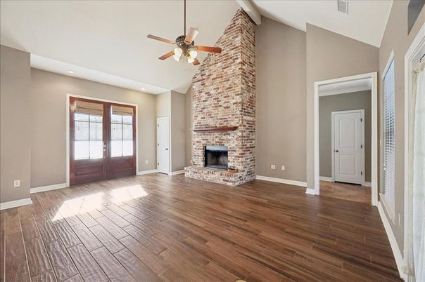 Empty room, Fireplace, Interior, Recessed Lighting, Stone Walls, Wood Texture Flooring