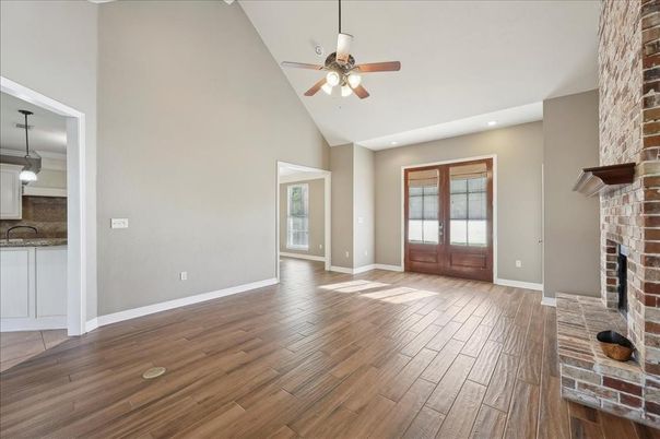 Empty room, Fireplace, Interior, Pendant Lights, Recessed Lighting, Stone Walls, Wood Texture Flooring
