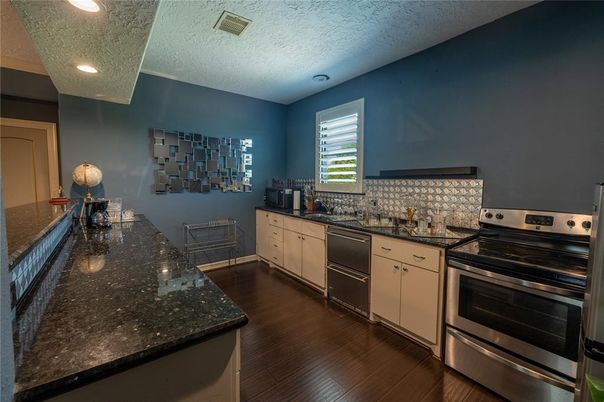 Dining room, Interior, Kitchen, Recessed Lighting, Stainless Steel Appliances, Wood Texture Flooring