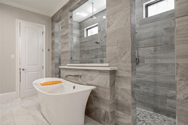 Bathroom, Free Standing Baths, Glass Shower, Interior, Marble, Marble Walls, Pendant Lights, Recessed Lighting