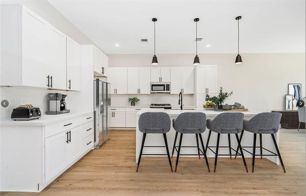 Interior, Kitchen, Pendant Lights, Recessed Lighting, Stainless Steel Appliances, Wood Texture Flooring