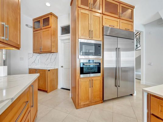 Interior, Kitchen, Marble Walls, Recessed Lighting, Stainless Steel Appliances