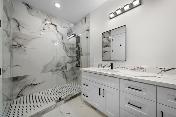 Bathroom, Dual Sink Vanities, Glass Shower, Interior, Marble, Marble Walls, Recessed Lighting