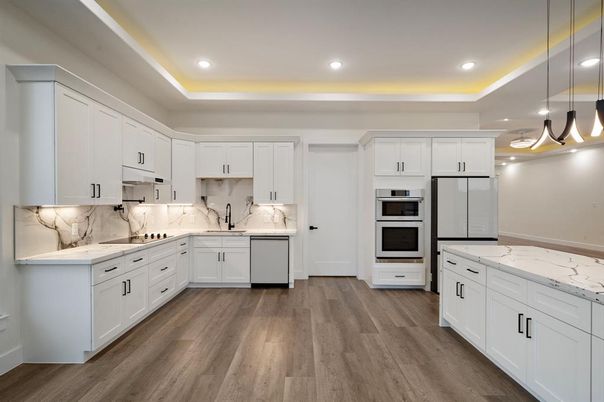 Interior, Kitchen, Marble Walls, Pendant Lights, Recessed Lighting, Stainless Steel Appliances, Wood Texture Flooring