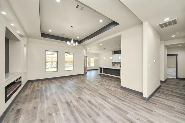Chandelier, Empty room, Fireplace, Interior, Pendant Lights, Recessed Lighting, Wood Texture Flooring