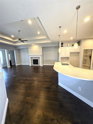 Empty room, Fireplace, Interior, Kitchen, Pendant Lights, Recessed Lighting, Wood Texture Flooring