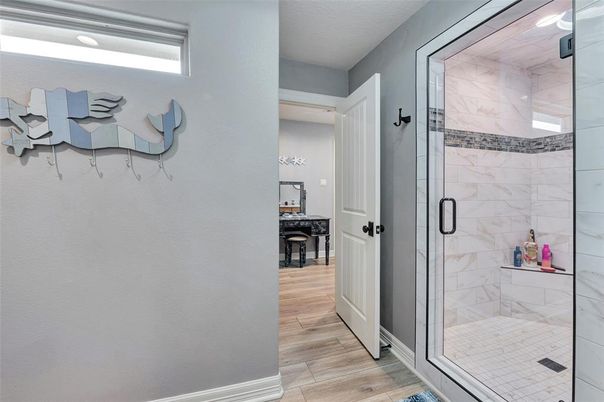 Bathroom, Glass Shower, Interior, Marble Walls, Wood Texture Flooring