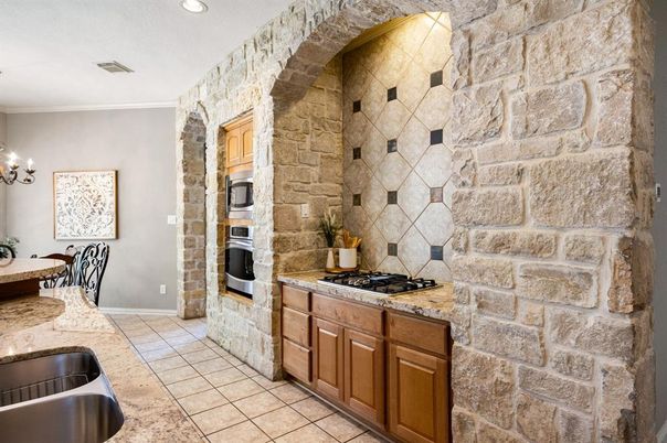 Interior, Kitchen, Recessed Lighting, Stainless Steel Appliances, Stone Walls