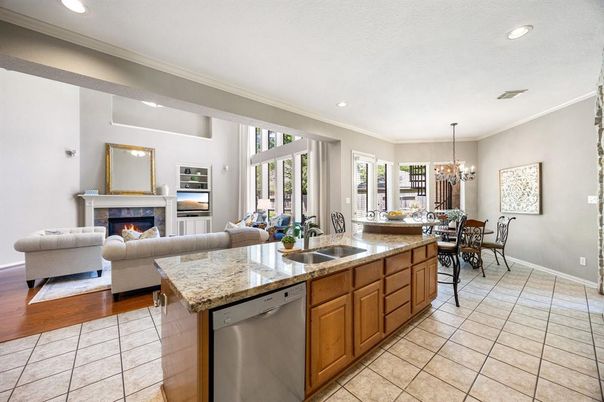 Chandelier, Dining room, Fireplace, Interior, Kitchen, Living room, Recessed Lighting, Stainless Steel Appliances