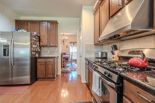 Chandelier, Dining room, Interior, Kitchen, Stainless Steel Appliances, Wood Texture Flooring