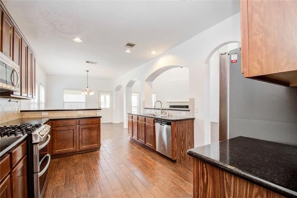 Interior, Kitchen, Pendant Lights, Recessed Lighting, Stainless Steel Appliances, Wood Texture Flooring