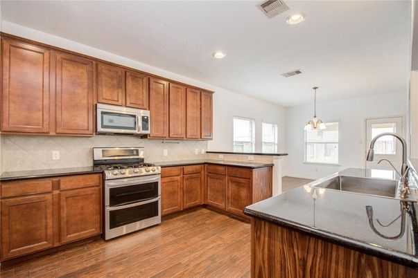 Interior, Kitchen, Pendant Lights, Recessed Lighting, Stainless Steel Appliances, Wood Texture Flooring