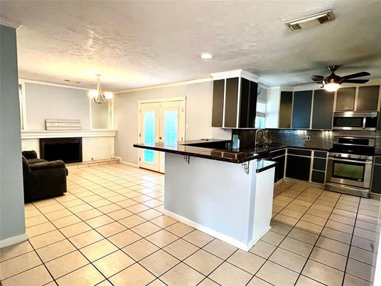 Chandelier, Fireplace, Interior, Kitchen, Recessed Lighting, Stainless Steel Appliances