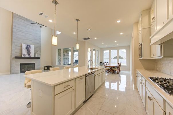 Dining room, Fireplace, Interior, Kitchen, Marble, Pendant Lights, Recessed Lighting, Stainless Steel Appliances