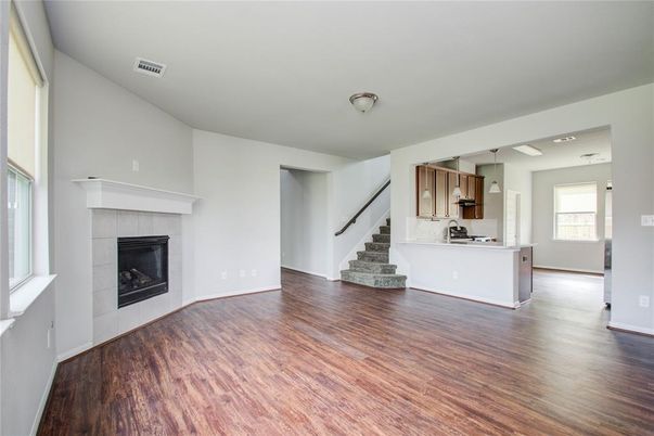 Empty room, Fireplace, Interior, Kitchen, Pendant Lights, Wood Texture Flooring