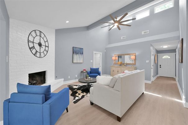 Fireplace, Interior, Living room, Recessed Lighting, Stone Walls, Wood Texture Flooring