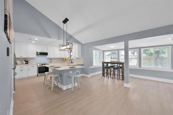 Dining room, Interior, Kitchen, Pendant Lights, Recessed Lighting, Stainless Steel Appliances, Wood Texture Flooring