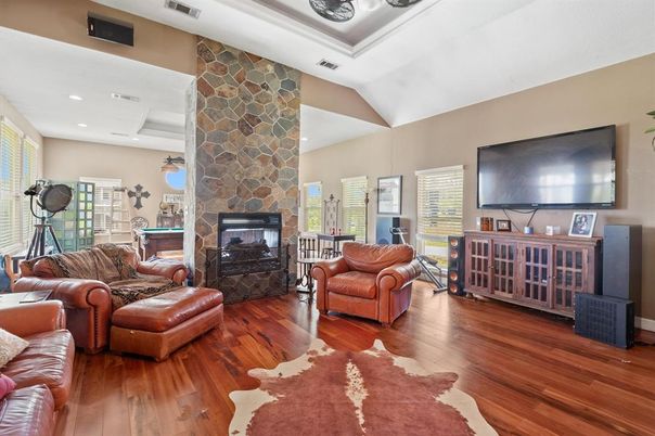 Fireplace, Interior, Living room, Recessed Lighting, Stone Walls, Wood Texture Flooring