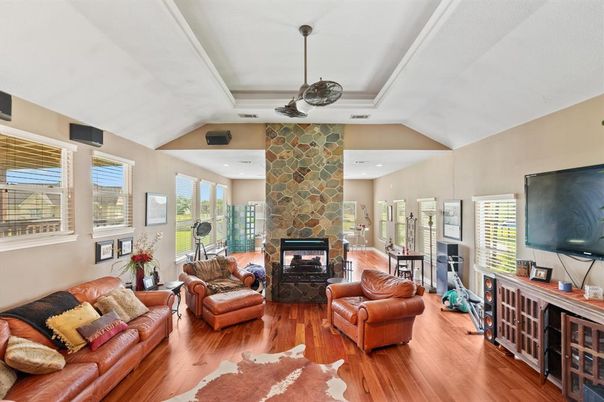 Fireplace, Interior, Living room, Pendant Lights, Recessed Lighting, Stone Walls, Wood Texture Flooring