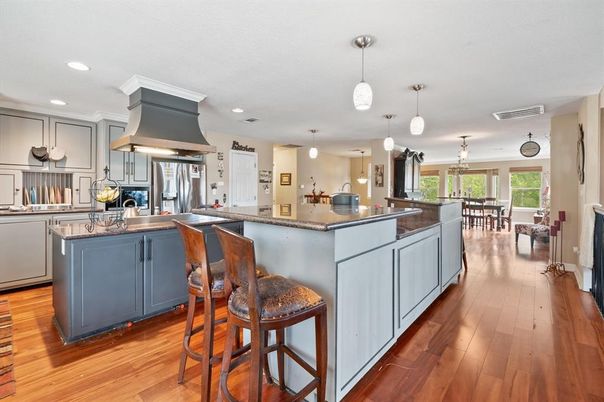 Dining room, Interior, Kitchen, Pendant Lights, Recessed Lighting, Stainless Steel Appliances, Wood Texture Flooring