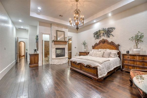 Bedroom, Chandelier, Fireplace, Interior, Recessed Lighting, Wood Texture Flooring