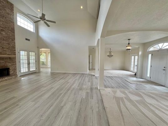 Chandelier, Empty room, Fireplace, Interior, Recessed Lighting, Stone Walls, Wood Texture Flooring
