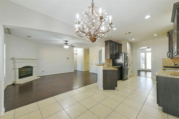 Chandelier, Fireplace, Interior, Kitchen, Recessed Lighting, Wood Texture Flooring