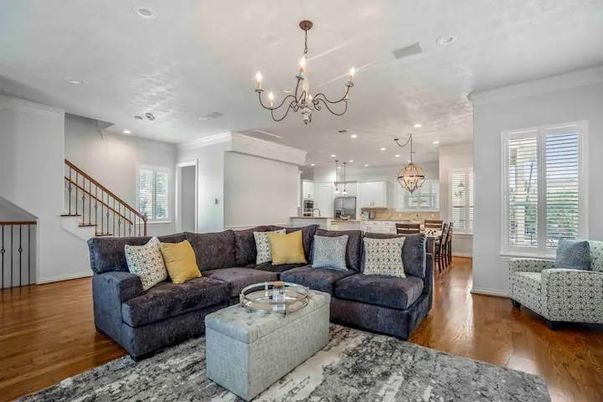 Chandelier, Dining room, Interior, Kitchen, Living room, Pendant Lights, Recessed Lighting, Stainless Steel Appliances, Wood Texture Flooring