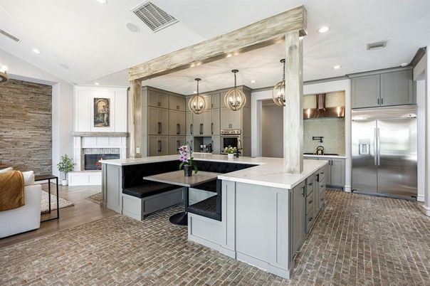 Fireplace, Interior, Kitchen, Pendant Lights, Recessed Lighting, Stainless Steel Appliances, Stone Walls, Wood Texture Flooring