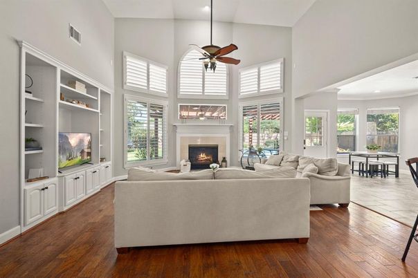 Dining room, Fireplace, Interior, Living room, Recessed Lighting, Wood Texture Flooring