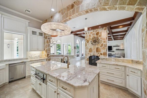Fireplace, Interior, Kitchen, Pendant Lights, Recessed Lighting, Stainless Steel Appliances, Stone Walls, Wooden Beams
