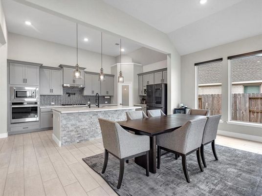 Dining room, Interior, Kitchen, Pendant Lights, Recessed Lighting, Stainless Steel Appliances, Wood Texture Flooring