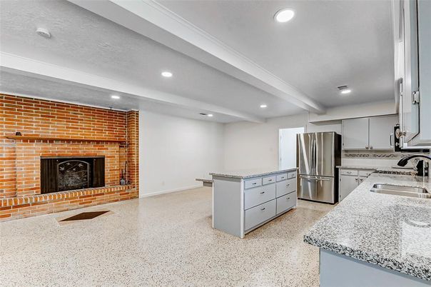 Fireplace, Interior, Kitchen, Recessed Lighting, Stainless Steel Appliances, Stone Walls