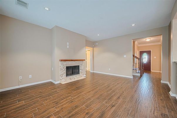 Empty room, Fireplace, Interior, Recessed Lighting, Wood Texture Flooring