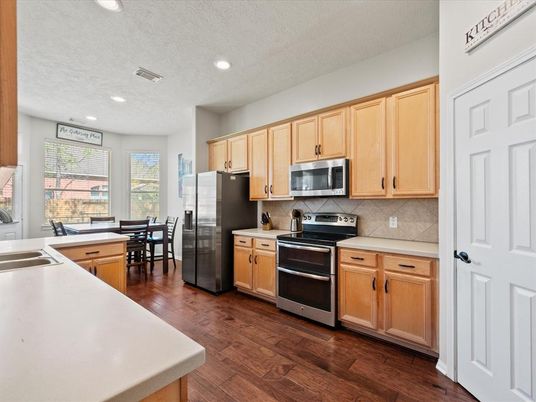 Dining room, Interior, Kitchen, Recessed Lighting, Stainless Steel Appliances, Wood Texture Flooring