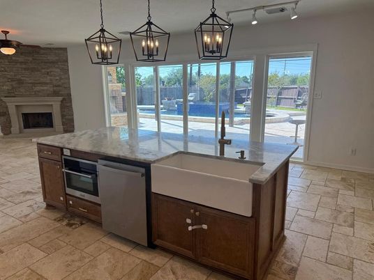 Fireplace, Interior, Kitchen, Pendant Lights, Stainless Steel Appliances, Stone Walls