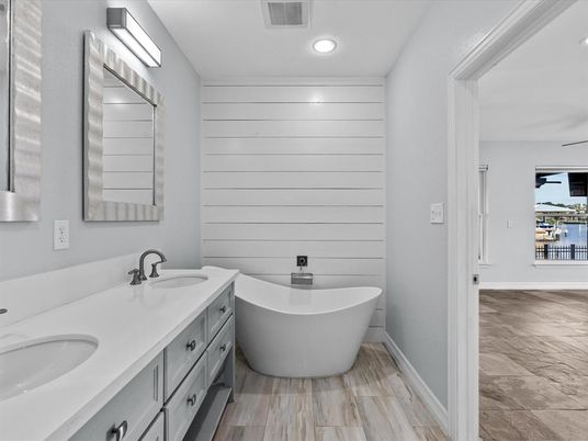 Bathroom, Dual Sink Vanities, Free Standing Baths, Interior, Recessed Lighting, Wood Texture Flooring