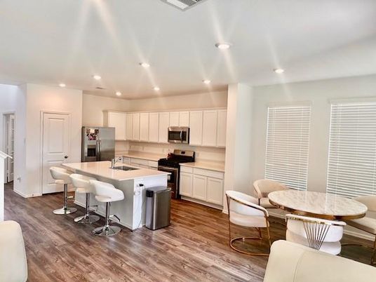 Dining room, Interior, Kitchen, Recessed Lighting, Stainless Steel Appliances, Wood Texture Flooring