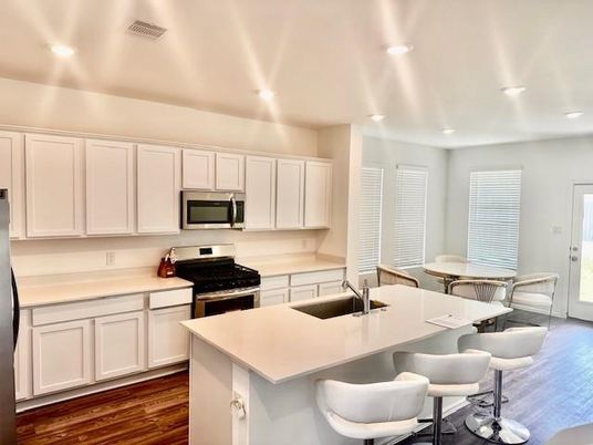 Dining room, Interior, Kitchen, Recessed Lighting, Stainless Steel Appliances, Wood Texture Flooring