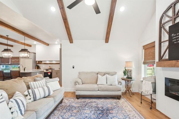 Fireplace, Interior, Kitchen, Living room, Pendant Lights, Recessed Lighting, Stainless Steel Appliances, Wooden Beams, Wood Texture Flooring