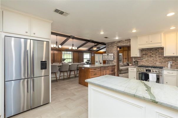 Interior, Kitchen, Recessed Lighting, Stainless Steel Appliances, Stone Walls